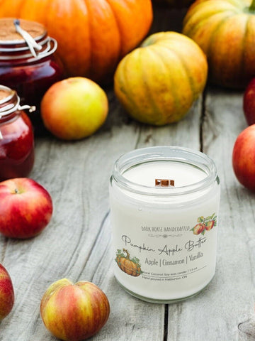 Pumpkin Apple Butter wood wick candle surrounded by fresh apples and pumpkins